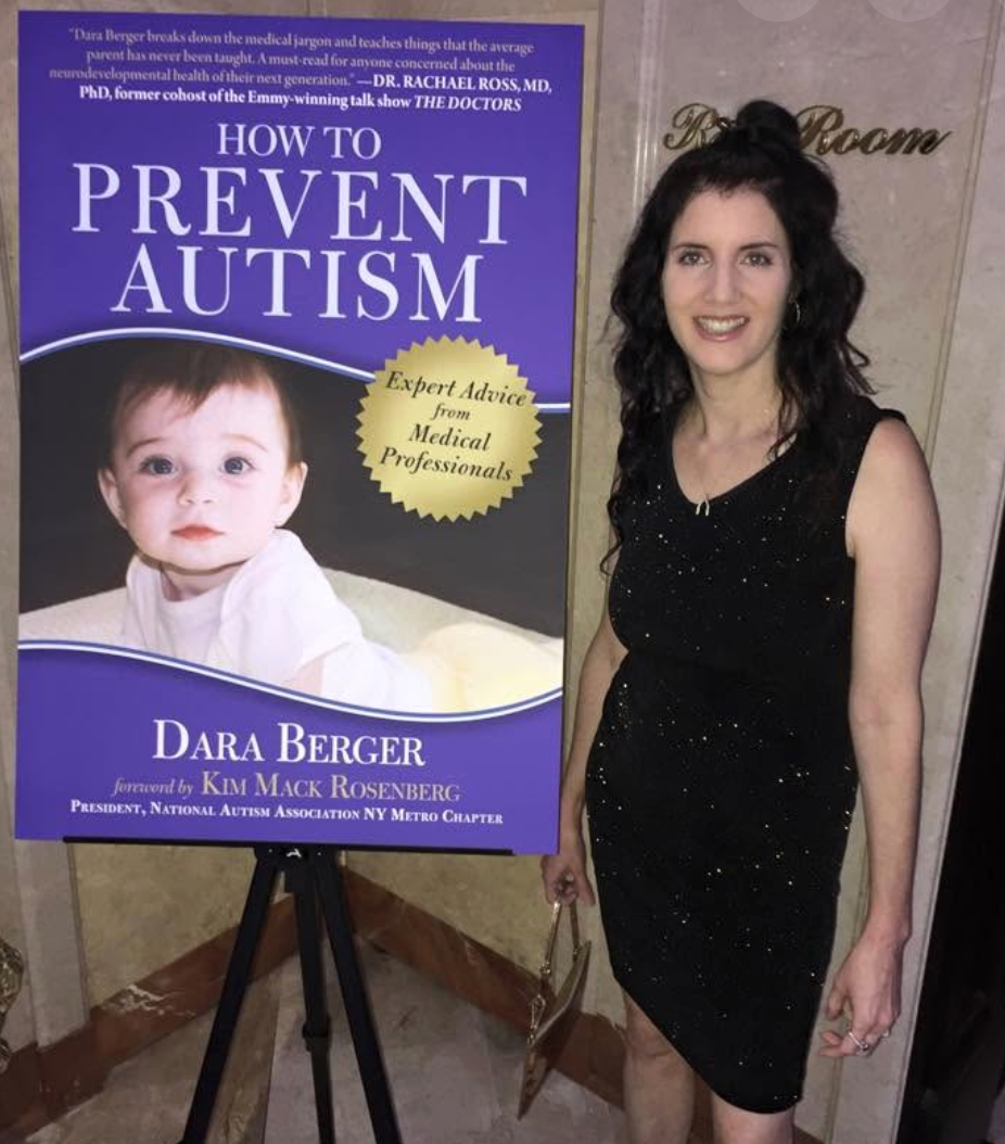 Dara Berger standing next to the How to Prevent Autism book cover